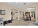 Open living space with neutral walls, arched doorways, and a formal dining area that flows into the entryway at 23520 San Sebastian Ct, Sorrento, FL 32776