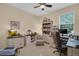 Comfortable office space with custom built in desk, cabinetry, and natural light from window at 23520 San Sebastian Ct, Sorrento, FL 32776