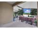 Enclosed patio with furniture, a ceiling fan, and views of the landscape at 23520 San Sebastian Ct, Sorrento, FL 32776