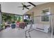 Enclosed patio with furniture, a ceiling fan, and a hanging swing at 23520 San Sebastian Ct, Sorrento, FL 32776