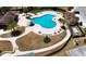 Stunning aerial view of the community pool, surrounded by ample seating and lush landscaping at 23520 San Sebastian Ct, Sorrento, FL 32776