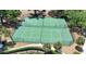 Overhead shot of community tennis and basketball courts with surrounding greenery, offering a recreational lifestyle at 23520 San Sebastian Ct, Sorrento, FL 32776