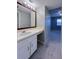 Well-lit bathroom featuring a vanity, mirror, and convenient access to the bedroom, enhancing daily routines at 2426 Branch Way # 200, Maitland, FL 32751