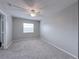 Comfortable bedroom with carpet, ceiling fan, and a window that fills the space with natural light at 2426 Branch Way # 200, Maitland, FL 32751