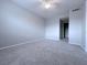 Spacious bedroom with new carpet, ceiling fan, and neutral paint, offering a serene retreat at 2426 Branch Way # 200, Maitland, FL 32751