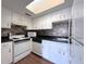 Functional kitchen with white cabinetry, appliances, and efficient layout for cooking at 2426 Branch Way # 200, Maitland, FL 32751