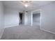 Inviting living room features new carpet, a ceiling fan, and a seamless flow to adjacent spaces at 2426 Branch Way # 200, Maitland, FL 32751