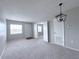 Bright living room with neutral carpet and paint, offering versatile layout options at 2426 Branch Way # 200, Maitland, FL 32751