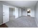 Spacious living room features neutral carpet, fresh paint, and easy access to the kitchen at 2426 Branch Way # 200, Maitland, FL 32751