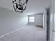 Bright living room with neutral carpet and paint with entrance and access to other rooms at 2426 Branch Way # 200, Maitland, FL 32751
