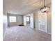 Bright, carpeted living room with lots of sunlight, neutral color scheme, and simple, elegant light fixture at 2426 Branch Way # 200, Maitland, FL 32751