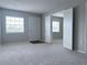 Bright living room with neutral paint, new carpet, and multiple windows for natural light at 2426 Branch Way # 200, Maitland, FL 32751