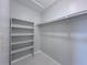 Organized walk-in closet with built-in shelving and ample hanging space, providing efficient storage solutions at 2426 Branch Way # 200, Maitland, FL 32751