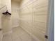 Spacious walk-in closet with ample shelving for organized storage at 2612 Shantiniketan Blvd # G12, Tavares, FL 32778