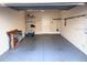 Spacious garage with shelving offers ample storage solutions for organization and convenience at 2612 Shantiniketan Blvd # G12, Tavares, FL 32778