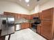 Spacious kitchen featuring stainless steel appliances and granite countertops at 2612 Shantiniketan Blvd # G12, Tavares, FL 32778