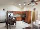 Open kitchen featuring stainless steel appliances and light brown cabinetry at 2612 Shantiniketan Blvd # G12, Tavares, FL 32778