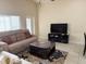 Inviting living room with large windows and comfortable seating at 2612 Shantiniketan Blvd # G12, Tavares, FL 32778
