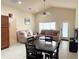 A view of the open concept living area showcasing furnishings and stainless appliances at 2612 Shantiniketan Blvd # G12, Tavares, FL 32778