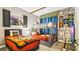 Harry Potter themed bedroom featuring a bunk bed, a twin bed, stone wall details, and decorative banners at 2791 Punctuation Pl, Kissimmee, FL 34746