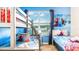 Themed bedroom with bunk beds, colorful decor, a large window, and playful accents at 2791 Punctuation Pl, Kissimmee, FL 34746