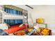Stylish Harry Potter themed bedroom features bunk beds, a twin bed, stone wall details, and a TV at 2791 Punctuation Pl, Kissimmee, FL 34746