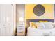 Comfortable bedroom with a queen bed, stylish nightstand, closet and a soothing color palette at 2791 Punctuation Pl, Kissimmee, FL 34746