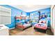 Charming bedroom with bunkbeds, twin bed and Frozen themed decor, creating a playful and inviting space at 2791 Punctuation Pl, Kissimmee, FL 34746