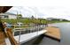 Community kayak launch featuring a dock, ramp, and colorful kayaks along the pond at 2791 Punctuation Pl, Kissimmee, FL 34746