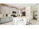 Modern kitchen with white countertops, gray cabinetry, stainless steel appliances, and a center island at 2791 Punctuation Pl, Kissimmee, FL 34746