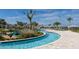 Relaxing lazy river winding through lush landscaping, offering a tranquil and enjoyable community amenity at 2791 Punctuation Pl, Kissimmee, FL 34746