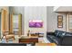 Cozy living room featuring stylish decor, high ceilings, a textured accent wall, and comfortable seating at 2791 Punctuation Pl, Kissimmee, FL 34746