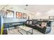 Cozy movie room with tiered seating, themed decor, comfortable chairs, and a large flat-screen TV at 2791 Punctuation Pl, Kissimmee, FL 34746