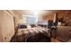 Bedroom featuring a queen sized bed and ample natural light at 2810 N Powers Dr # 59, Orlando, FL 32818