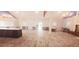 Spacious event space featuring wood floors, ample seating and view of the kitchen area at 2810 N Powers Dr # 59, Orlando, FL 32818