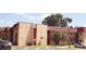 Attractive condominium building exterior with red-trimmed windows and well-kept landscaping at 2810 N Powers Dr # 59, Orlando, FL 32818
