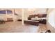 Open floor plan kitchen with a long breakfast bar and modern black appliances at 2810 N Powers Dr # 59, Orlando, FL 32818