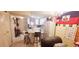 Open concept kitchen with island and refrigerator featuring white cabinets and stainless steel appliances at 2810 N Powers Dr # 59, Orlando, FL 32818
