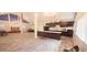Open floor plan kitchen with black appliances and a long breakfast bar with seating at 2810 N Powers Dr # 59, Orlando, FL 32818