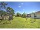 This sprawling yard includes a swing set, manicured lawn, and a screened-in pool area that's perfect for outdoor fun at 2850 Babylon Ct, Oviedo, FL 32765