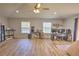 Spacious bonus room with neutral walls, wood-look tile floors, ceiling fan, and multiple windows at 2850 Babylon Ct, Oviedo, FL 32765