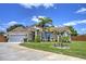Lovely one-story home featuring lush landscaping, a well-maintained lawn, and a spacious two-car garage at 2850 Babylon Ct, Oviedo, FL 32765