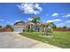 Charming one-story home featuring lush landscaping, a well-maintained lawn, and a spacious two-car garage at 2850 Babylon Ct, Oviedo, FL 32765