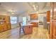 Open kitchen features a large island, wood cabinets, modern appliances and views of the pool at 2850 Babylon Ct, Oviedo, FL 32765