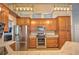 Well-equipped kitchen with stainless steel appliances, granite countertops, and ample cabinet space at 2850 Babylon Ct, Oviedo, FL 32765