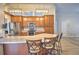 Open kitchen features large island, granite countertops, stainless appliances and modern lighting at 2850 Babylon Ct, Oviedo, FL 32765