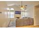 Inviting living room with vaulted ceiling, fireplace, large TV and comfortable seating at 2850 Babylon Ct, Oviedo, FL 32765