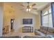 Cozy living room with vaulted ceilings, a ceiling fan, large window, and comfortable seating at 2850 Babylon Ct, Oviedo, FL 32765