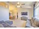 Inviting living room featuring neutral carpet, vaulted ceilings, a ceiling fan, and lots of natural light at 2850 Babylon Ct, Oviedo, FL 32765