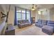 Comfortable living room with a cozy sofa, large windows, and stylish decor, creating a welcoming atmosphere at 2850 Babylon Ct, Oviedo, FL 32765